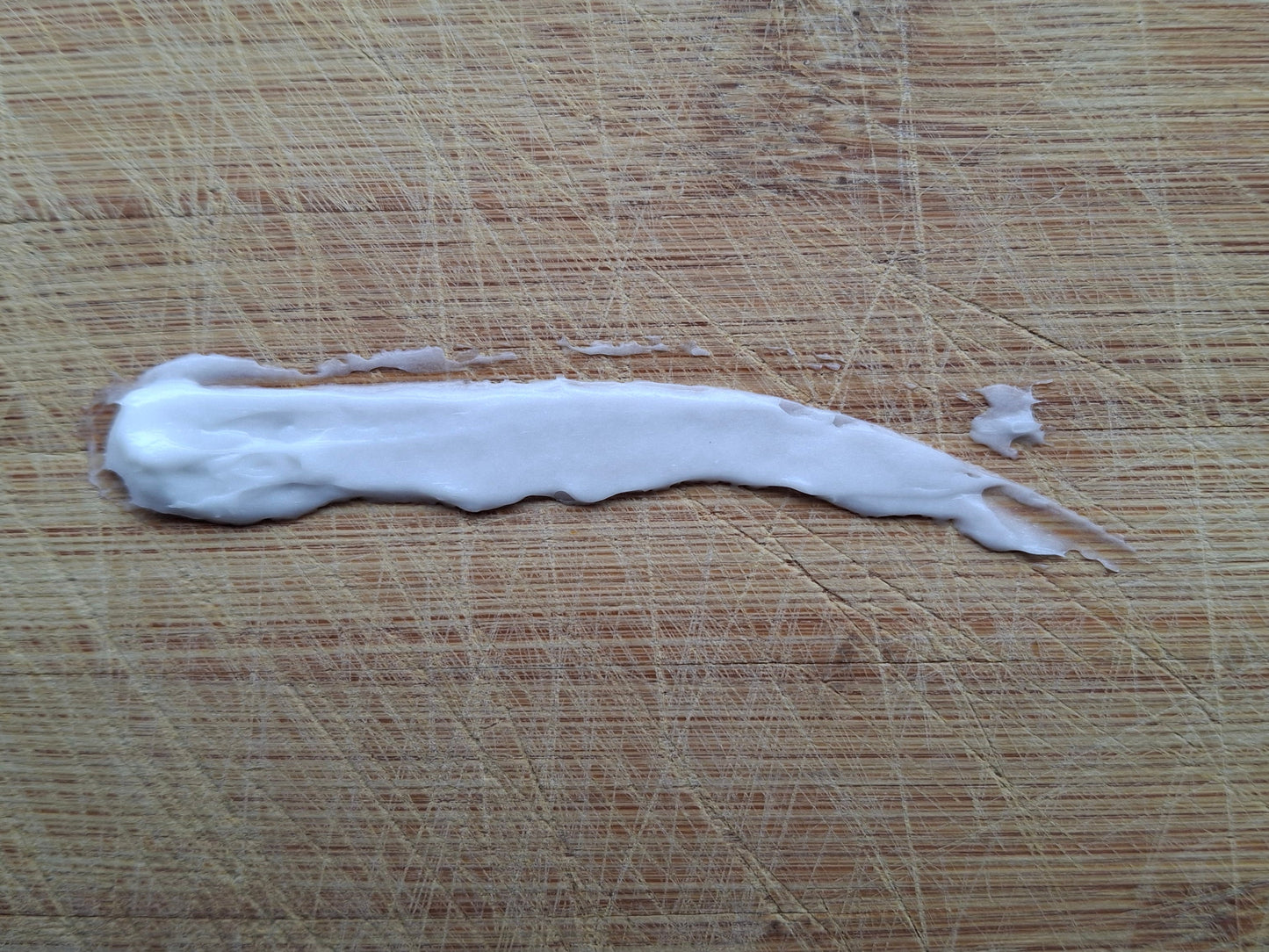 niacinamide cream on a wooden surface